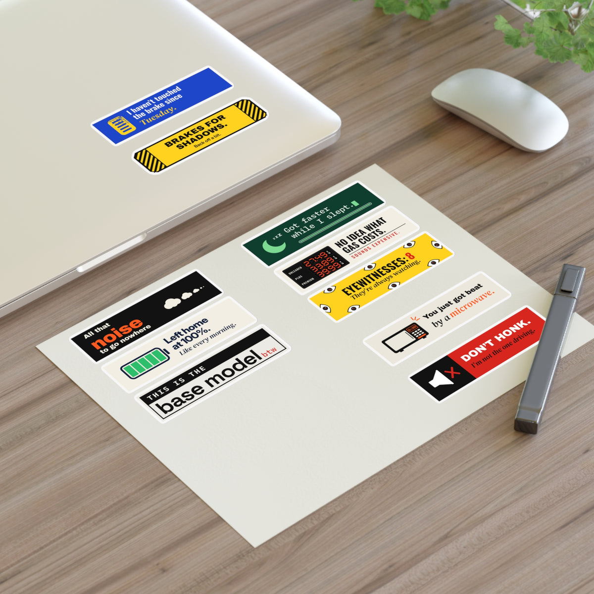 Mini 10-Pack (our picks), sticker sheet on a desk by a laptop